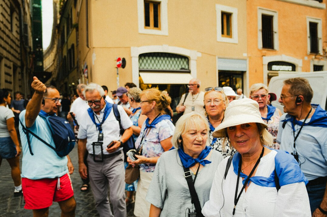 Group of seniors on a guided walking tour outdoors