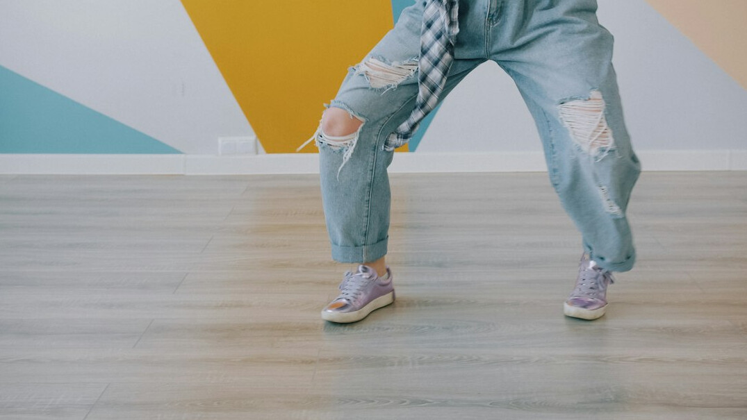 Older adults dancing together in a bright dance studio