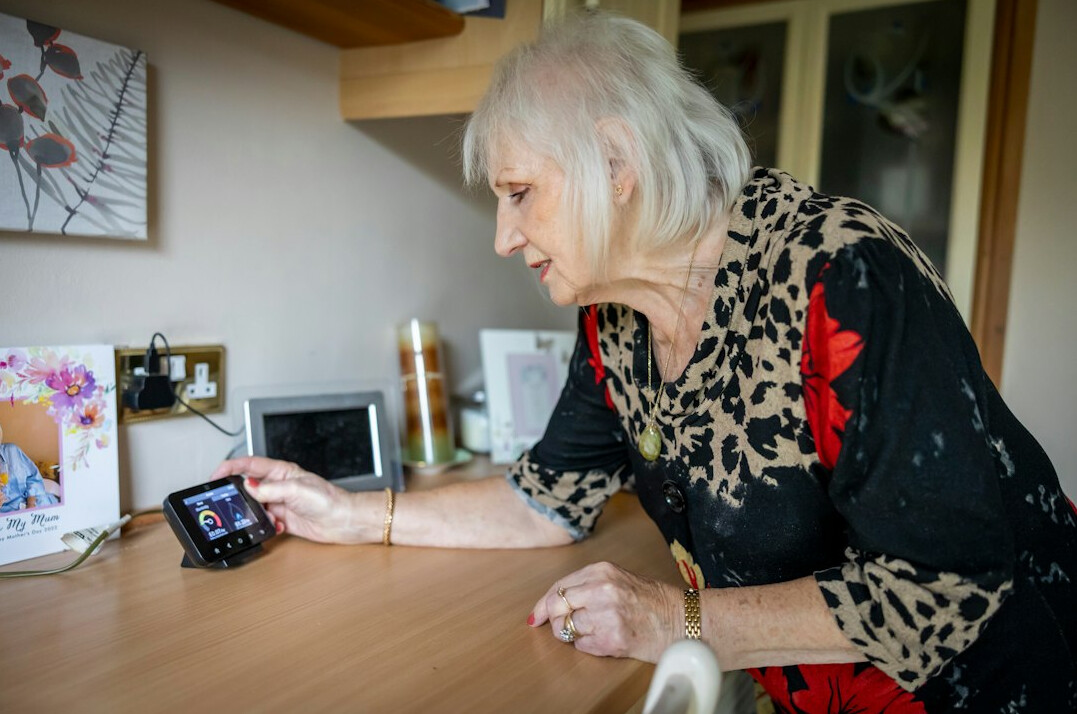 Older adults learning to use tablets and computers in a class
