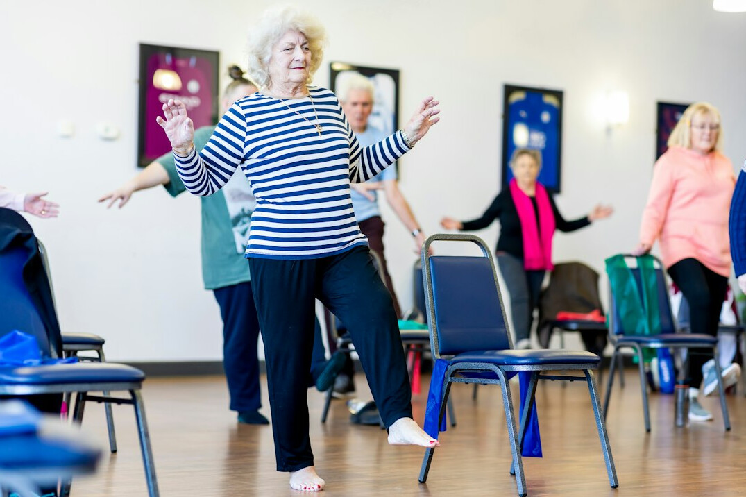 group of seniors doing yoga