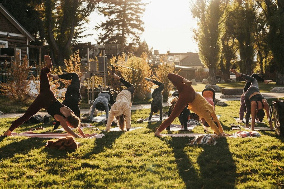 seniors doing yoga outdoors