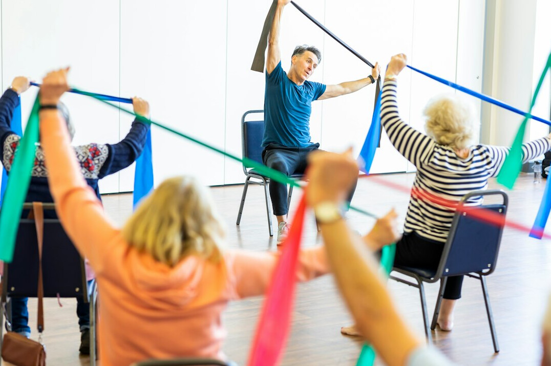 group of seniors doing yoga